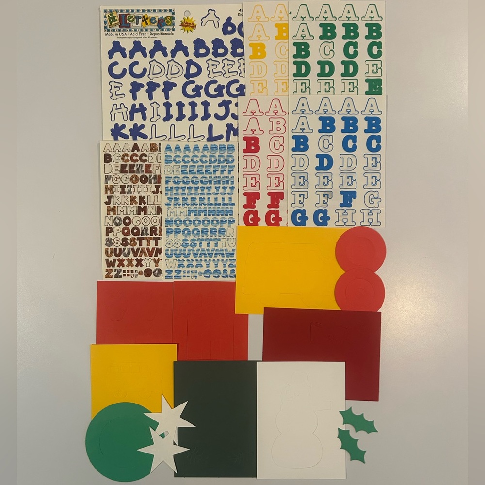 Scrapbooking alphabet stickers and die cut decorative shapes